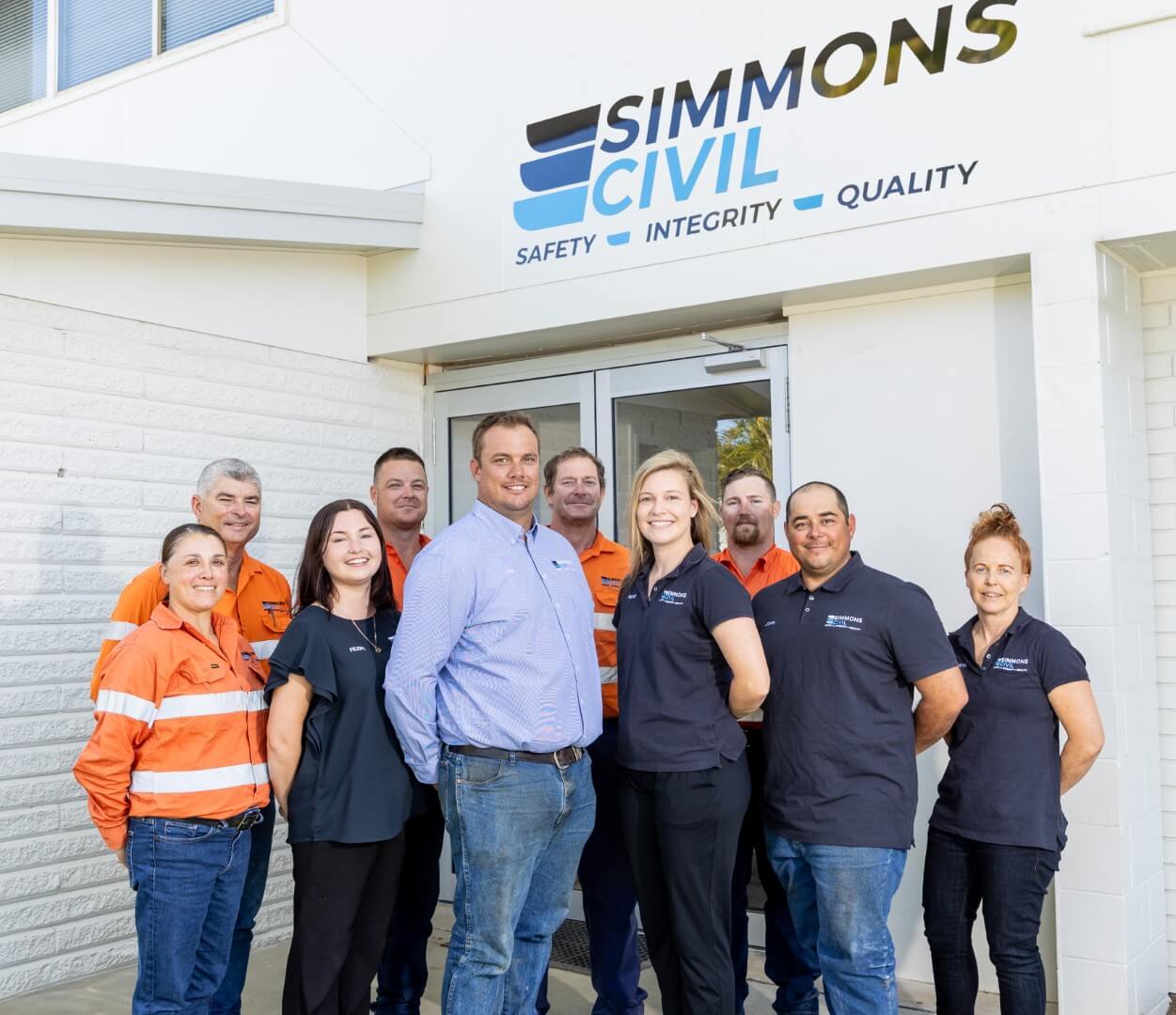 Simmons Civil team standing outside their office building