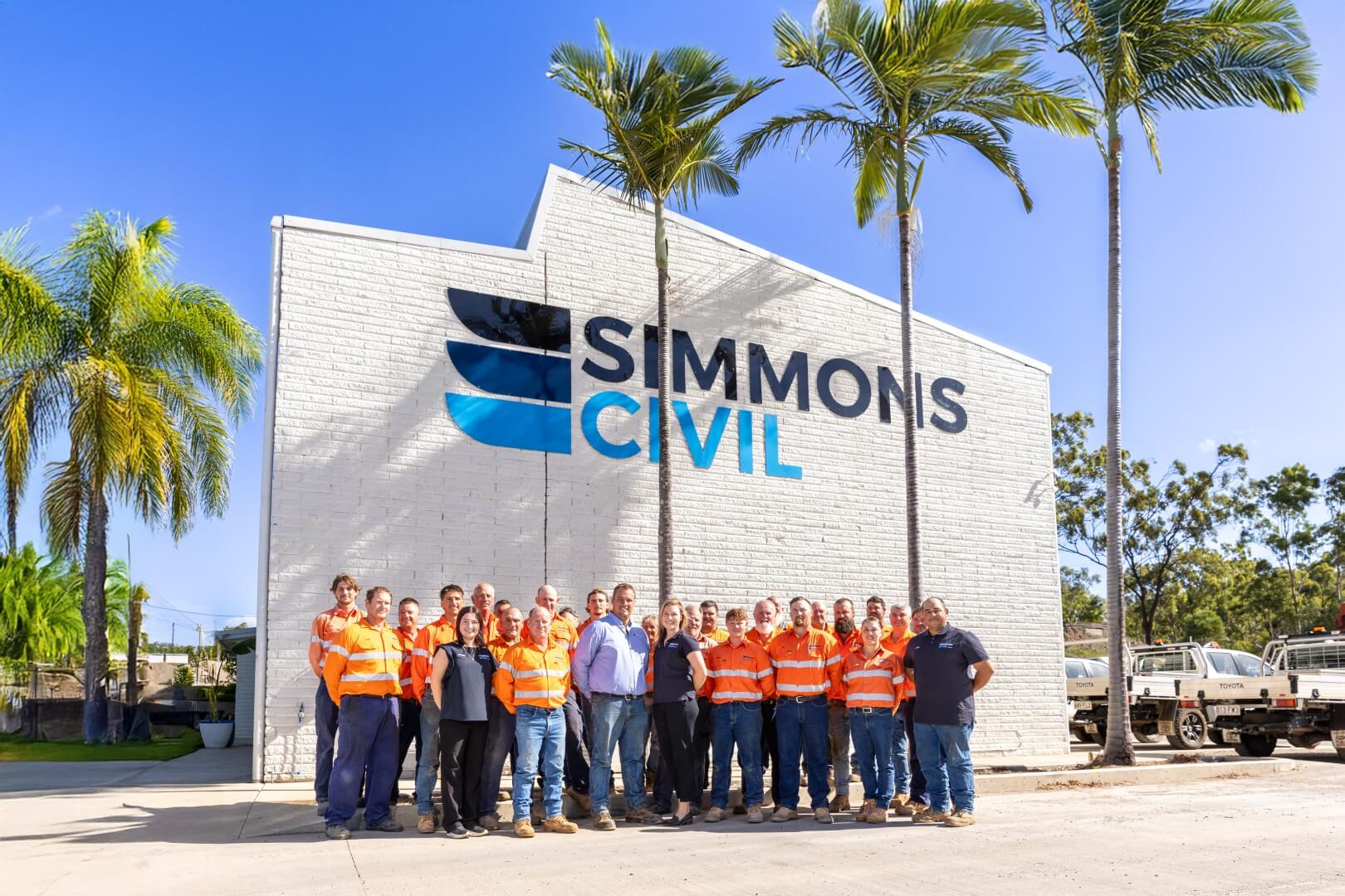 Simmons Civil team standing outside their office building